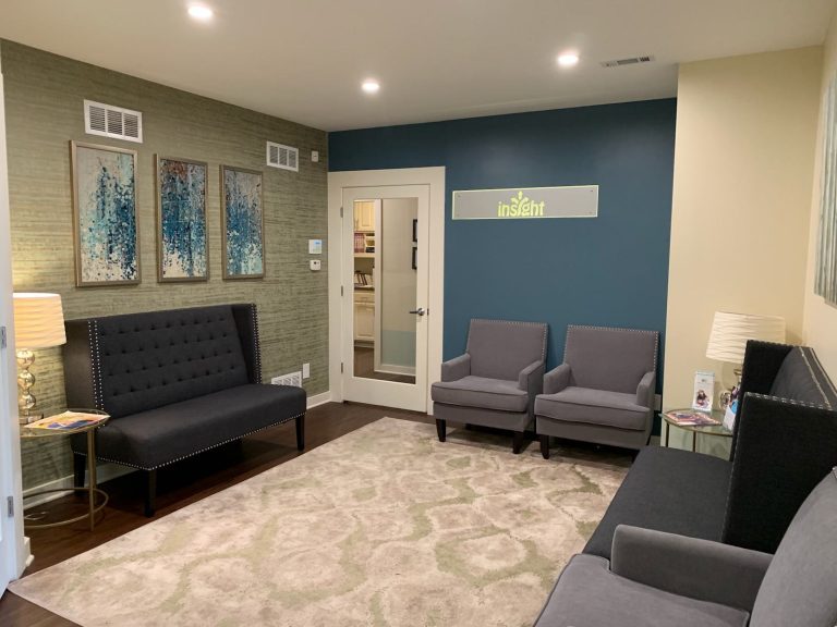 Insight Women’s Center waiting room with the Insight sign on the wall
