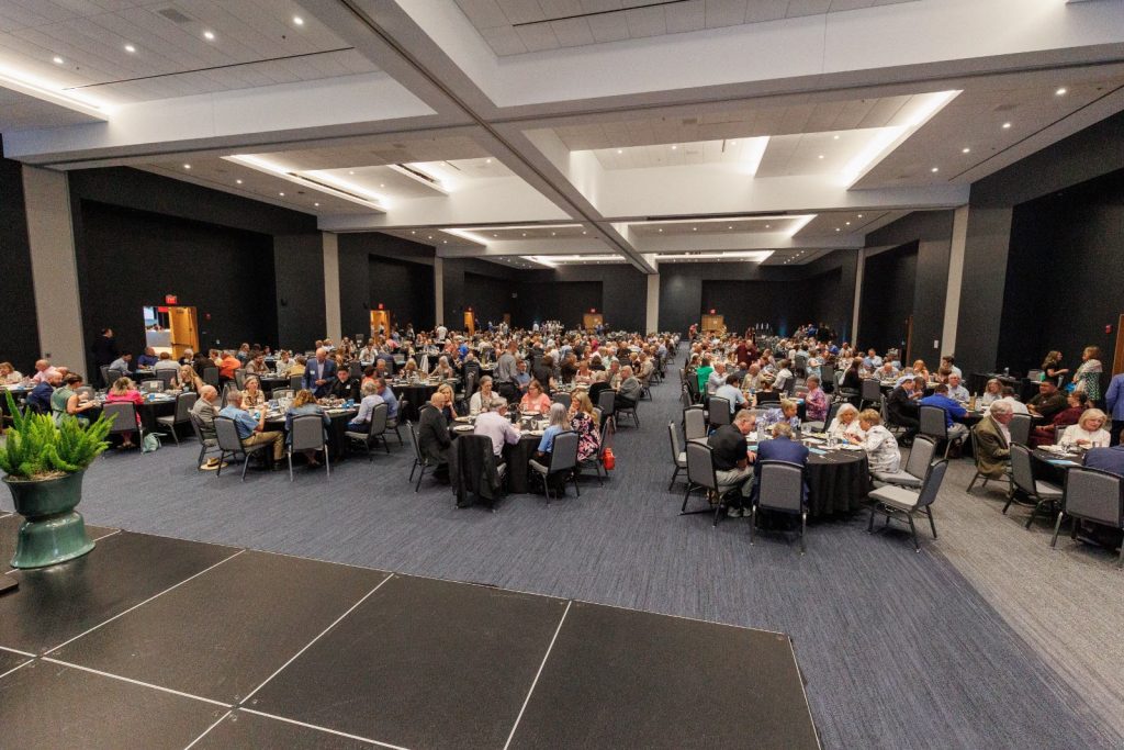 A full banquet hall of guests seated at the Spring Fundraiser